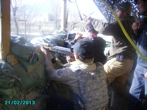 Members of a QRT team receive instruction during live-fire training.